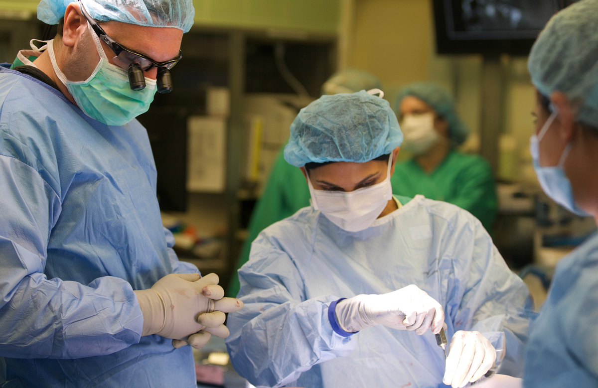 doctors performing surgery